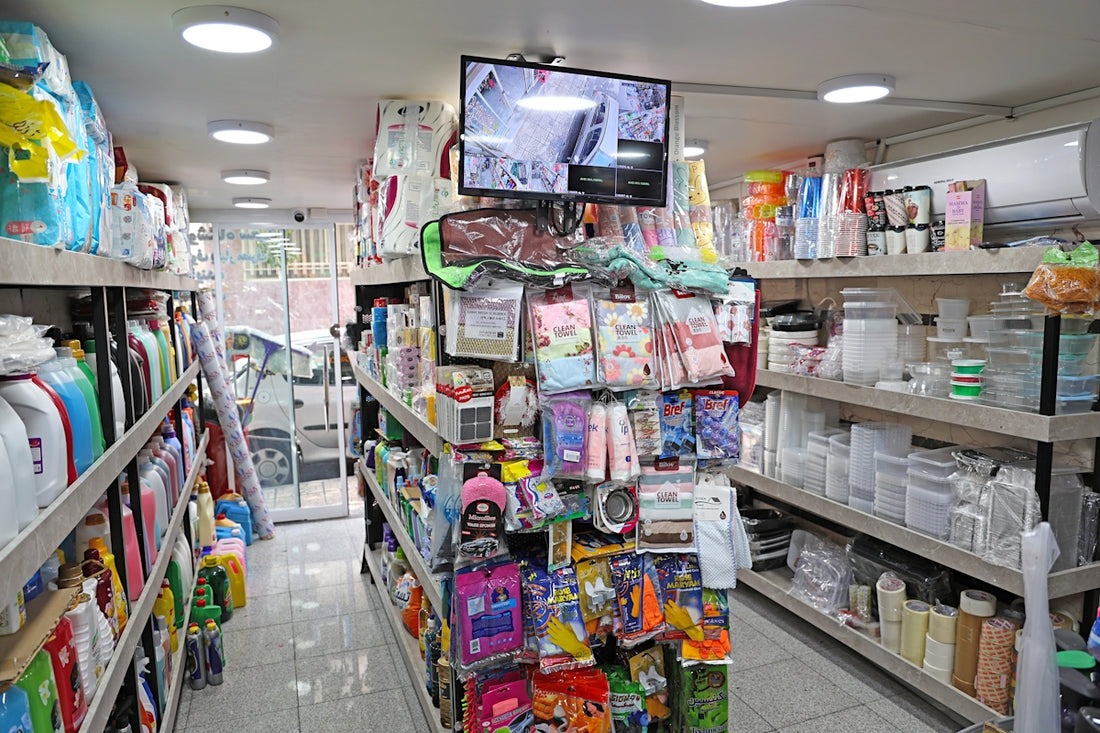 A retail store aisle filled with various merchandise.
